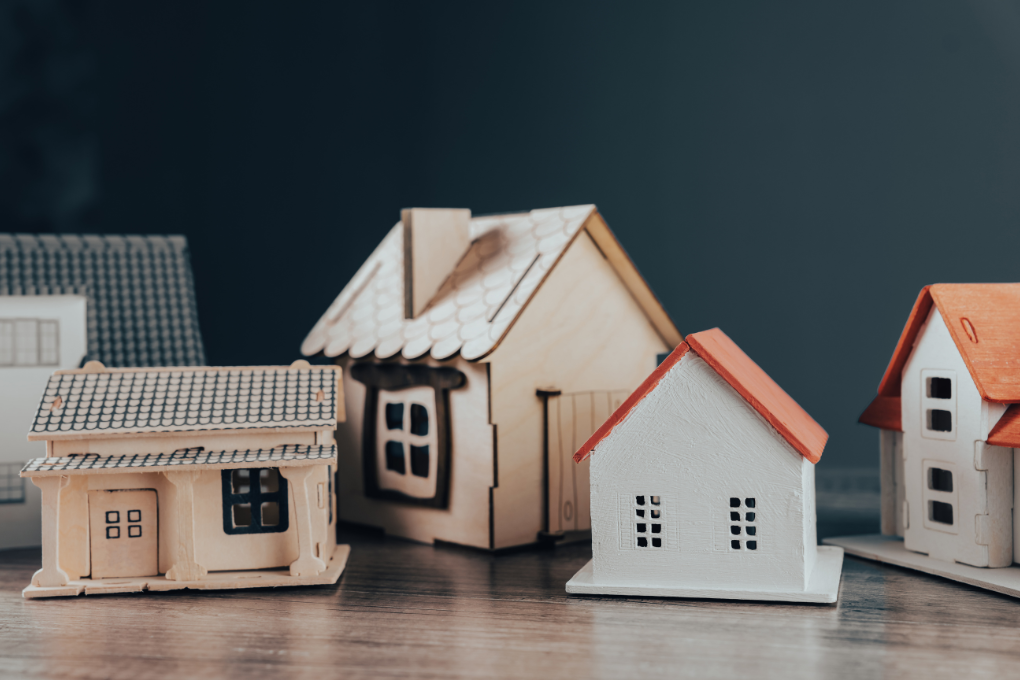 Small toy houses on a table.