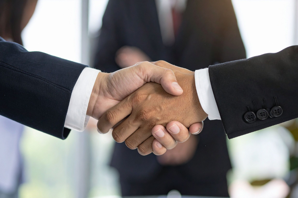 Two people shaking hands.